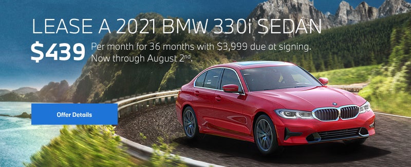 Red 3 series going around a bend on oceanside highway