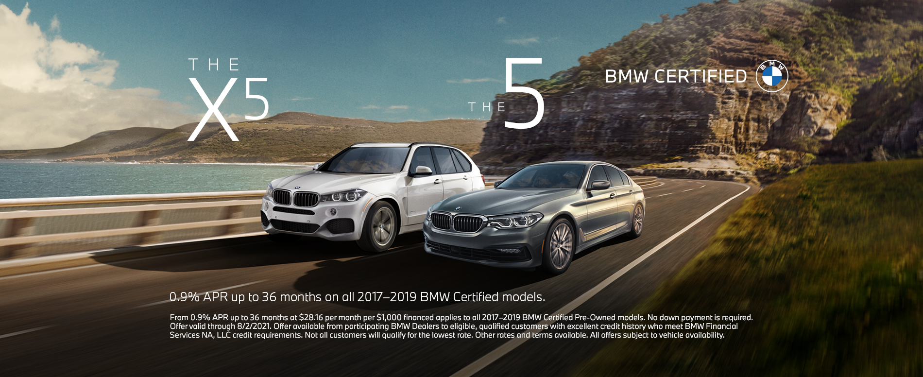 Two cars driving down a coastal highway. Two cars driving do