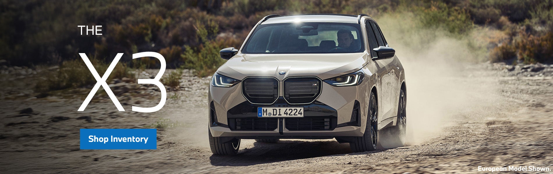 BMW X3 driving on dirt orad parked with a forest landscape. | Weatherford BMW of Berkeley in Berkeley CA