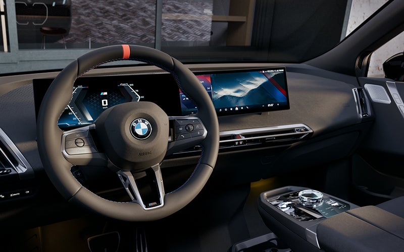 Interior steering wheel and dashboard of the BMW iX M70. | Weatherford BMW of Berkeley in Berkeley CA
