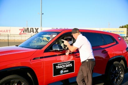 track day at sonoma man in bmw with man pointing