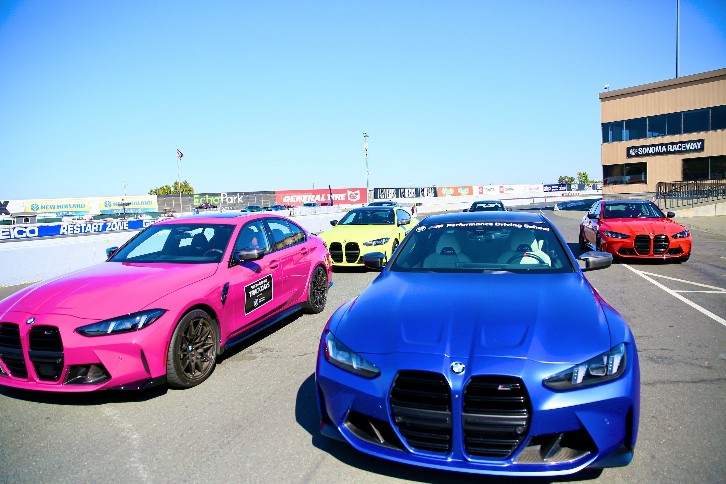 track day at sonoma pink and blue bmws