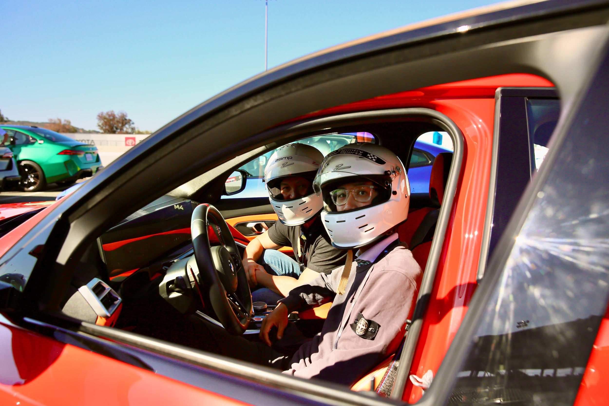 track day at sonoma two people in bmw wearing race gear